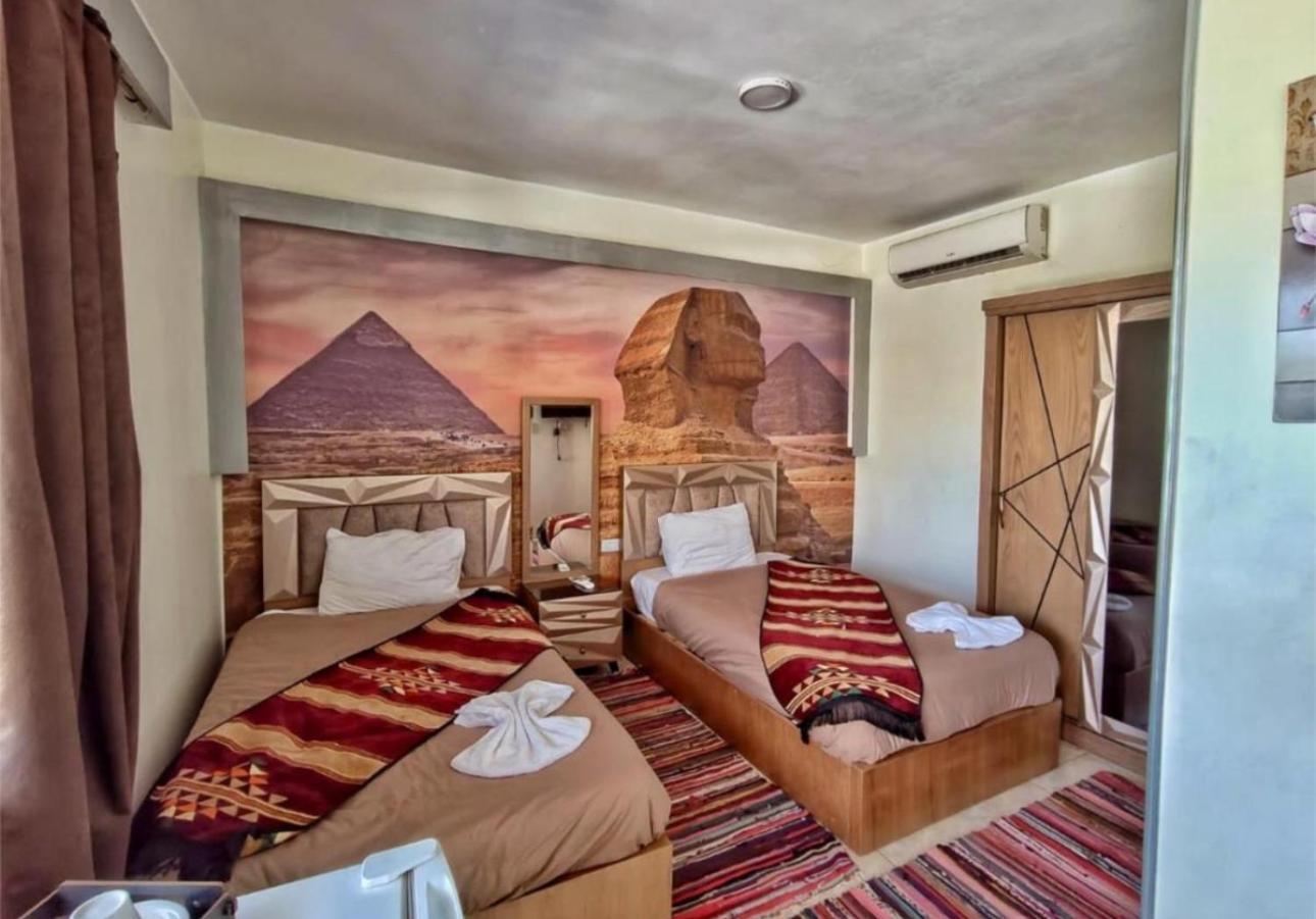 Nefertiti Pyramids View